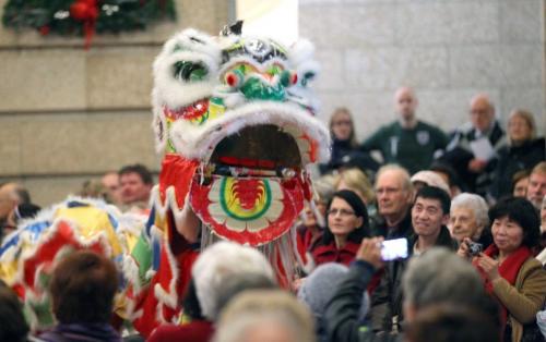 Dancers perform a traditional Chinese Dragon Dance at the base of the Grand Staircase at the Manitoba Legislature Tuesday. The performance met with applause by guests waiting to greet the Lt Governor at his annual Levee. See release/story? Jan 1, 2013 - (Phil Hossack / Winnipeg Free Press)