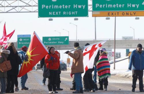 About 40 Idle No More protestors blocked St Charles St and Portage Ave at 1PM Wednesday The protest prevented traffic on Portage Ave from going through in bolth east and west directions- See Story- January 02, 2013   (JOE BRYKSA / WINNIPEG FREE PRESS)
