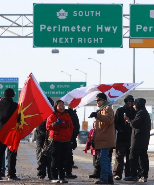 About 40 Idle No More protestors blocked St Charles St and Portage Ave at 1PM Wednesday The protest prevented traffic on Portage Ave from going through in bolth east and west directions- See Story- January 02, 2013   (JOE BRYKSA / WINNIPEG FREE PRESS)
