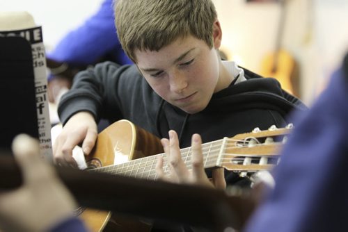 WIndsor School class of 2017 students. Jesse practice guitar in class. See Doug Speirs story on bullying. Dec 22, 2012, Ruth Bonneville (Ruth Bonneville / Winnipeg Free Press)