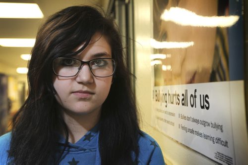 WIndsor School class of 2017 students.  Shelby stands next to one of the many posters hung on the walls in the hallways of the school. See Doug Speirs story on bullying. Dec 22, 2012, Ruth Bonneville  (Ruth Bonneville /  Winnipeg Free Press)