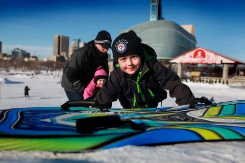 Five year old Tyler Free climbs the toboggan hill at the Forks Saturday afternoon while sliding with his sister Alana - 3yrs and parents.   Standup photo. Jan 03, 2013, Ruth Bonneville  (Ruth Bonneville /  Winnipeg Free Press)