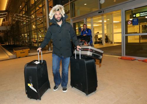 Toronto Blue Jays', Jose Bautista, pulls his luggage out of James Armstrong Richardson Airport, January 5, 2013. Winnipeg is one of the stops on the 3rd Annual Toronto Blue Jays Winter Tour. (TREVOR HAGAN/WINNIPEG FREE PRESS)