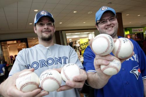 Michael Clarke, 34, and brother Steven Clarke, 30, with the game balls they had autographed by the Toronto Blue Jays who are in town while on a cross country fan appreciation tour. Organizers of the event are unofficially saying around 2500 fans showed up to get a chance to meet Jays' Brett Cecil, Aaron Loup and Jose Bautista at Polo Park Shopping Centre.  130106 January 6, 2013 Mike Deal / Winnipeg Free Press