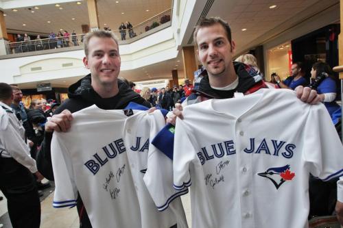 Twins Barret (left) and Braden Frith, 27, with the jerseys they had autographed by the Toronto Blue Jays who are in town while on a cross country fan appreciation tour. Organizers of the event are unofficially saying around 2500 fans showed up to get a chance to meet Jays' Brett Cecil, Aaron Loup and Jose Bautista at Polo Park Shopping Centre.  130106 January 6, 2013 Mike Deal / Winnipeg Free Press