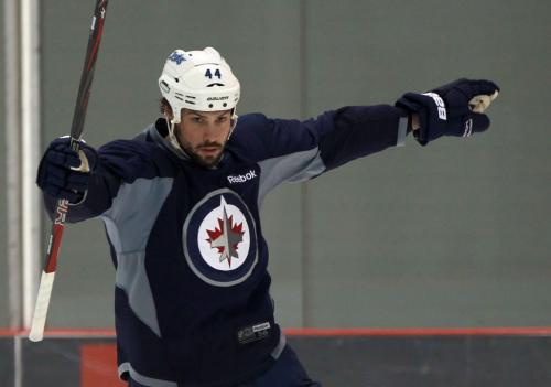 Showing his colours- Winnipeg Jet Zach Bogosian skates at MTS Iceplex in Winnipeg Monday with his Winnipeg Jets jersey on- a welcome sight to fans after the NHL 117 day lockout  See Ed Tait story- January 07, 2013   (JOE BRYKSA / WINNIPEG FREE PRESS)