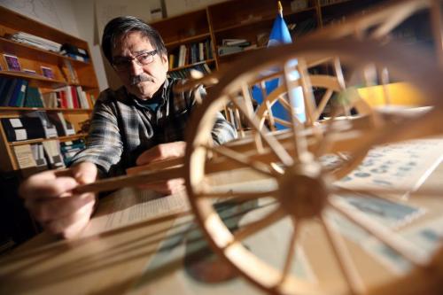 Randy Ranville at the Metis Culture & Heritage Resource Centre on Albert Street with a miniature Red River Ox Cart, January 9, 2013. (TREVOR HAGAN/WINNIPEG FREE PRESS)