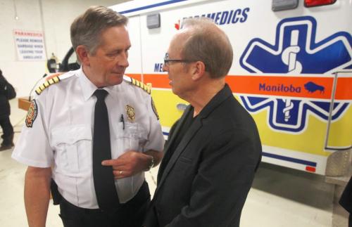 Winnipeg Fire and Paramedic Service Chief Reid Douglas with mayor Sam Katz next o  new ambulance at news conference announcing more paramedics and 911 call takers will be hired-See Jen Skerritt story- January 10, 2013   (JOE BRYKSA / WINNIPEG FREE PRESS)