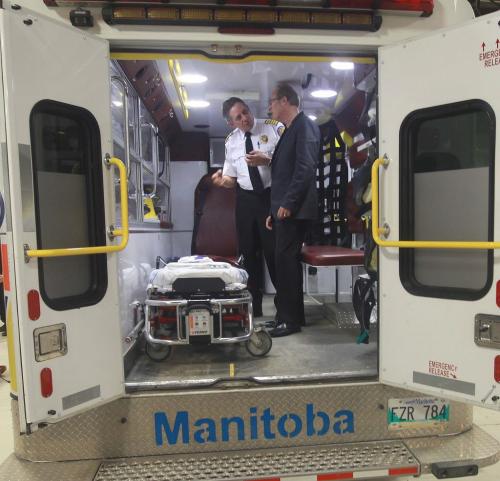 Winnipeg Fire and Paramedic Service Chief Reid Douglas with mayor Sam Katz inside new ambulance at news conference announcing more paramedics and 911 call takers will be hired-See Jen Skerritt story- January 10, 2013   (JOE BRYKSA / WINNIPEG FREE PRESS)