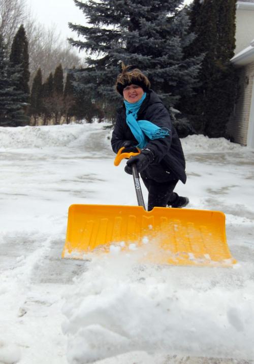 Photo taken at the home of Janice Lukes, coordinator with Winnipeg Trails Association. Janice Lukes is a local fitness expert talking about New Year's resolutions. In this shot Janice shovelling her driveway. That's her resolution. STORY APPEARING: Monday Life front. January 11, 2013  BORIS MINKEVICH / WINNIPEG FREE PRESS