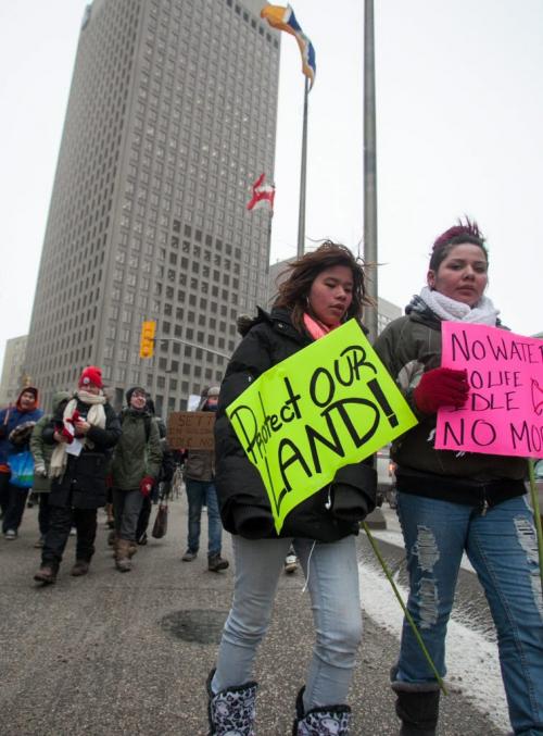 Idle No More marchers made their way from the Forks along Main and then Portage to UW around noon Friday. (Melissa Tait / WInnipeg Free Press)