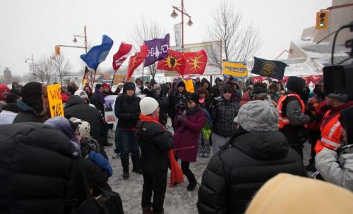Idle No More marchers made their way from the Forks along Main and then Portage to UW around noon Friday. (Melissa Tait / WInnipeg Free Press)