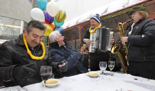 The wind was blowing as left Mike Veroukis and Dan Milne begin there first course at Orlando's Seafood Grill on Corydon during the 30th anniversary Polar Bear Lunch held on the outdoor patio Friday with lively music supplied by Barry Gorlick on the accordion and Doug Wilson on sax.  All proceeds raised at the event went to the Manitoba Theatre For Young People.      (WAYNE GLOWACKI/WINNIPEG FREE PRESS) Winnipeg Free Press  Jan. 11 2013