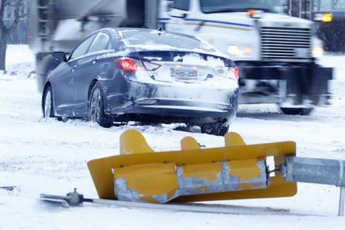 A traffic light sits on the ground at the corner of Harrow Street and Taylor Avenue after being struck by a car, Saturday, January, 2013. (TREVOR HAGAN/ WINNIPEG FREE PRESS)