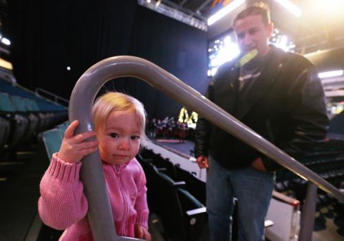 Ava McKenzie, 1, and her father, Alan, at a memorial service at MTS Centre for the victims of the massacre in Newtown, Connecticut, Saturday 12, January, 2013. (TREVOR HAGAN/ WINNIPEG FREE PRESS)