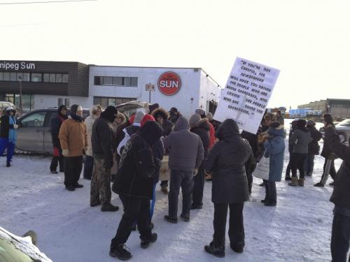 Approximately 75 people gathered outside the offices of the Winnipeg Sun to protest the Sun Media chain's recent online coverage of Canadian aboriginal issues Saturday afternoon, January 12, 2013. See Bill Redekop story. (MELISSA TAIT / WINNIPEG FREE PRESS)