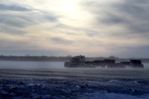 A semi makes its way  eastward on a blustery number One Highway to Winnipeg just outside Headingley Saturday afternoon. Standup photo.  Jan 12, 2013, Ruth Bonneville  (Ruth Bonneville /  Winnipeg Free Press)