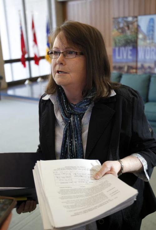 Elizabeth LaBelle, cat advocate with petition to not put cat licensing cash into general revenue outside the Standing Policy Committee, Protection and Community Services meeting Monday. Jen Skerritt story (WAYNE GLOWACKI/WINNIPEG FREE PRESS) Winnipeg Free Press  Jan. 14 2013