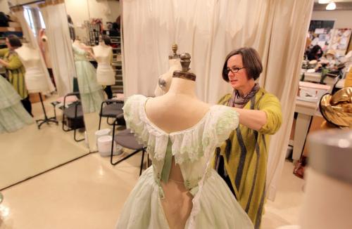 Costume designer Judith Bowden reckons there are around 200 costumes in all and Scarlett O' Hara herself has 17 costumes. Portraits of Bowden puts the finishing touches on Scarlet's iconic barbeque dress in the sewing area of MTC. Jan 09, 2013, Ruth Bonneville  (Ruth Bonneville /  Winnipeg Free Press)
