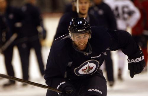 Jets  captain Andrew Ladd demonstrates acceleration during drill  KEN GIGLIOTTI / JAN 15 2013 / WINNIPEG FREE PRESS