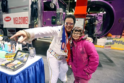 Brandon Sun 15012013 Earl Oxford student Deanna Lockie poses for a photo with elvis impersonator Kevin LaFlamme during the Manitoba Ag Days show on Tuesday. (Tim Smith/Brandon Sun) (Tim Smith/Brandon Sun)