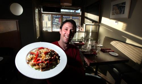 Joel Boulet, one of the owners at Cafe Carlo on Lilac, bradishes the cafe's signature dish, fett Chile. See Sanderson's ICON piece. January 16th, 2013 - (Phil Hossack / Winnipeg Free Press)