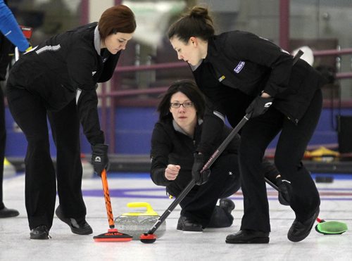 Brandon Sun Liza Park makes her shot as teammates Kortney Teale (left) and Pam Robins sweep, Wednesday evening at the Brandon Curling Club. (Colin Corneau/Brandon Sun)