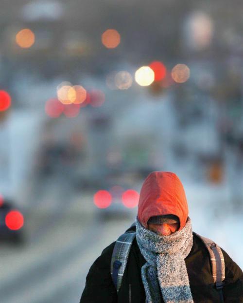 Frozen Morning- A chilly pedestrian makes the long walk over the Slaw Rebchuk bridge in Winnipeg Thursday morning- Temperatures will get even colder this weekend with wind chills near -40C-Standup photo - January 17, 2013   (JOE BRYKSA / WINNIPEG FREE PRESS)