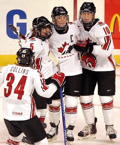 BORIS MINKEVICH / WINNIPEG FREE PRESS  070403 Canada vs. Switzerland IIHF World Women's hockey Championship. Haley Wickenheiser (with the C on the jersey) celebrates after scoring the 3rd goal in the game. In the first Period.