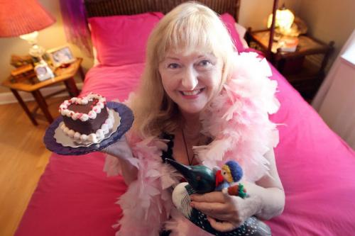 Maureen Scurfield, well-known spicy advice columnist Miss Lonelyhearts who appears in the Winnipeg Free Press with her favorite stuff- Her bed, her feathers, chocolate, and memories from her parents-See My Stuff Column- January 17, 2013   (JOE BRYKSA / WINNIPEG FREE PRESS)