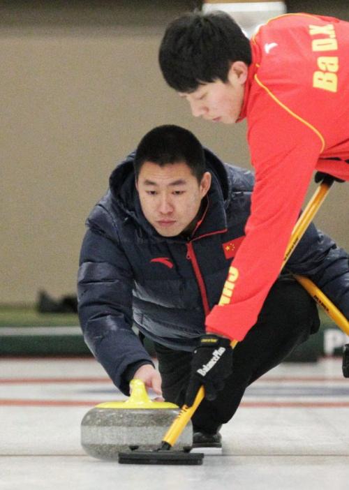 Skip Rui Liu of the Chinese National Team throws a rock in the second end of their first game of the MCA Bonspiel against the defending MCA champions and past American champions Team Brown from Madison, WI during the opening night at the Granite Curling Club. 130117 January 17, 2013 Mike Deal / Winnipeg Free Press