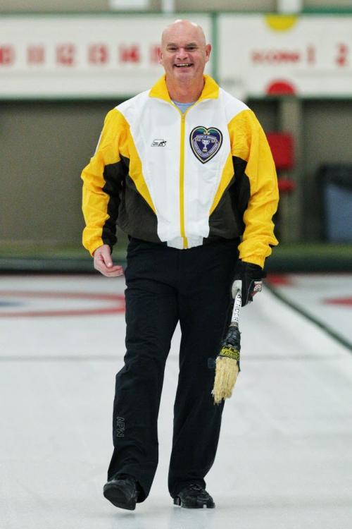 Kerry Burtnyk laughs after throwing the first rock during the opening night of the MCA Bonspiel at the Granite Curling Club. 130117 January 17, 2013 Mike Deal / Winnipeg Free Press
