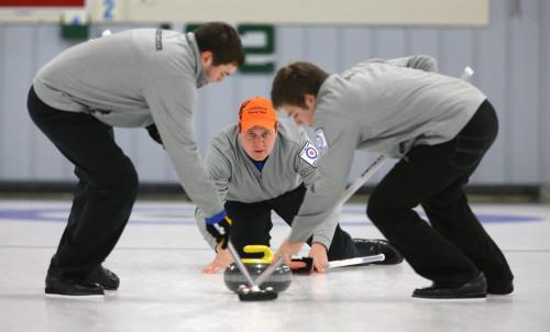 John Landsteiner and Jared Zezel sweep for skip, John Schuster, from Deluth, Minnesota as he curls against a team from China skipped by Rui Liu, at the Thistle Curling Club, during the MCA Men's Bonspiel, Saturday, January 19, 2013. (TREVOR HAGAN/WINNIPEG FREE PRESS)