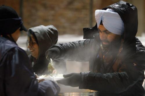 Kulwinder Sing Layal, a member of the Deshmesh Darbar Temple, serving food at a mobile soup kitchen behind the Siloam Mission, Saturday, January 19, 2013. Sikhs around the world celebrate Ruru Gobind Singh's birthday. (TREVOR HAGAN/WINNIPEG FREE PRESS)