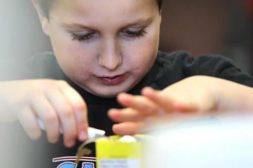 Reynolds School in the RM of Reynolds  a hour and a half east of Winnipeg has only 9 kids attending ithe school due to low enrollment. Nine year old Devon Nazor in grade 4 helps measure some ingredients for the cookies that the class is making. See Nick Martin's story. Jan 16 2013, Ruth Bonneville  (Ruth Bonneville /  Winnipeg Free Press)