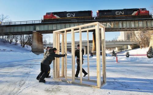A crew from Garnet Construction starts work on a warming hut on the river trail at The Forks. The hut titled Big City will be made of several of these framed blocks and will be wrapped in a Tyvec a type of plastic used in building construction.  130121 January 21, 2013 Mike Deal / Winnipeg Free Press