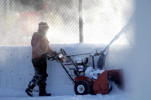 Barbara Choboter is the care taker for the Bord- Aire CC on Hampton Street and was charged with the task of blowing out all the snow from the rinks in the bitter cold. January 21, 2013  BORIS MINKEVICH / WINNIPEG FREE PRESS