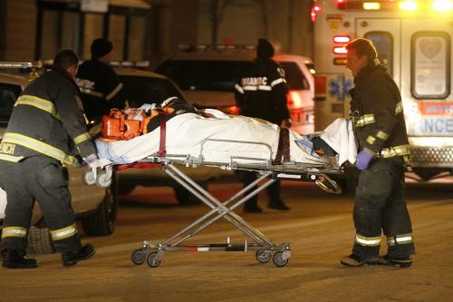 January 22, 2013 - 130122  -  Emergency personnel remove a stabbing victim from 400 Kennedy Tuesday January 22, 2013.  John Woods / Winnipeg Free Press