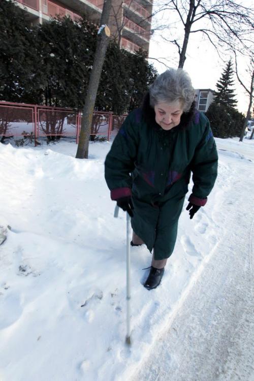 Elsie Karl lives at 765 Akins Street and is really not happy about the sidewalks near her block. They are not shoveled and are very slippery. January 23, 2013  BORIS MINKEVICH / WINNIPEG FREE PRESS