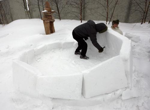 right Fred Ford learned to build igloos in  Baker Lake ( in white parka) and left Zacharias  Kunuk   from Igloonik Nunavut  are building 2 ,  9ft by 7ft  tall igloos  on the roof top  patio of the WAG -Two igloos are being built  courtesy of the Mb. Urban Inuit Ass. , the public can visit the igloos  that coincide with the opening of Creation & TransformatioN:Defining Moments of Inuit Art  highlighting 115 works of inuit art from the WAG Collection KEN GIGLIOTTI / JAN. 24 2013 / WINNIPEG FREE PRESS