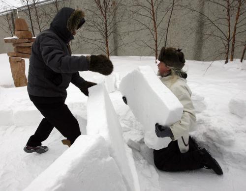 right Fred Ford learned to build igloos in Baker Lake ( in white parka) and left Zacharias Kunuk from Igloonik Nunavut are building 2 , 9ft by 7ft tall igloos on the roof top patio of the WAG -Two igloos are being built courtesy of the Mb. Urban Inuit Ass. , the public can visit the igloos that coincide with the opening of Creation & TransformatioN:Defining Moments of Inuit Art highlighting 115 works of inuit art from the WAG Collection KEN GIGLIOTTI / JAN. 24 2013 / WINNIPEG FREE PRESS