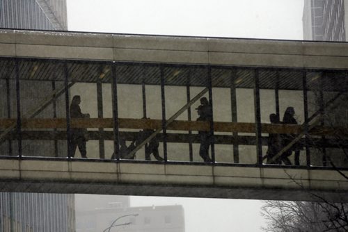 Stdup Weather - Staying warm and Dry -22 with and Snow is falling on downtown Wpg and the preferred method of travel is skywalk as seen over  Smith St. At Graham Mall  KEN GIGLIOTTI / JAN. 24 2013 / WINNIPEG FREE PRESS