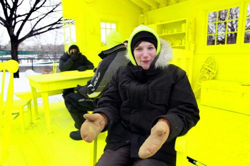 Landscape architect Liz Wreford Taylor (front) along with her fellow teammates who created the HyggeHouse Warming Hut  which is a cozy interior scene of  home painted completely flurorescent yellow to give the viewer a pychological experience of warmth.   See Randy Turner's story. Jan 24, 2013, Ruth Bonneville  (Ruth Bonneville /  Winnipeg Free Press)