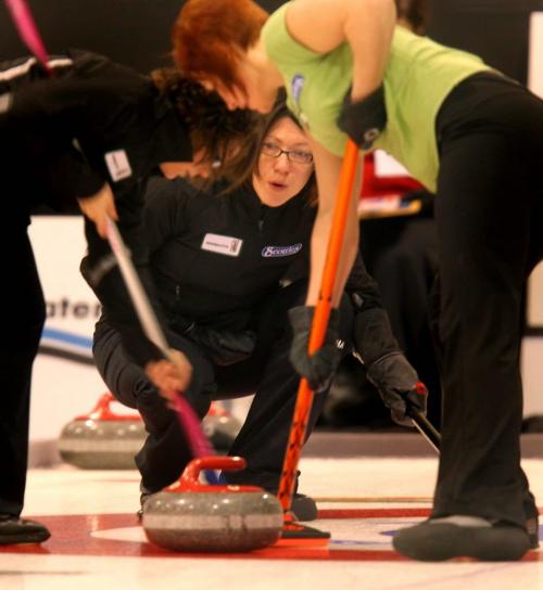 Liza Park in the thick of things against Michelle Montford THursday evening at the Tournament of Hearts in Stonewall. January 24, 2013 - (Phil Hossack / Winnipeg Free Press)