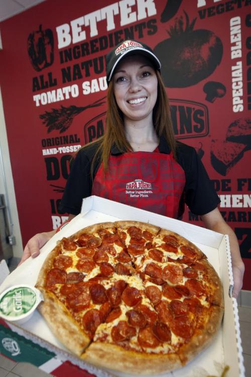 PIZZA WARS in Winnipeg companies are gearing up for stiff competition  from new players coming into the market place .Erin  Macdonald co-owner of Papa John's Pizza  at Pembina and Grant Ave with peperoni   pizza   KEN GIGLIOTTI / JAN. 25 2013 / WINNIPEG FREE PRESS