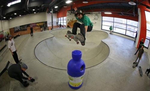 A young skateboarder jumps out of the pool and above a recycling bin at The Edge Skatepark, Saturday, January 26, 2013. (TREVOR HAGAN/WINNIPEG FREE PRESS)