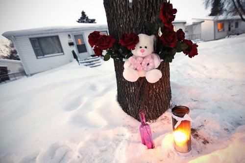 January 28, 2013 - 130128  -  A memorial has been setup outside 595 Kylemore Monday January 28, 2013. Winnipeg's first murder of the year occured here..  John Woods / Winnipeg Free Press. Michael Daniel Bourget, 28, of Winnipeg turned himself in early Thursday morning,  January 24 2013 police said. He is charged in the death of Jenilee Rose Ballantyne, 22.