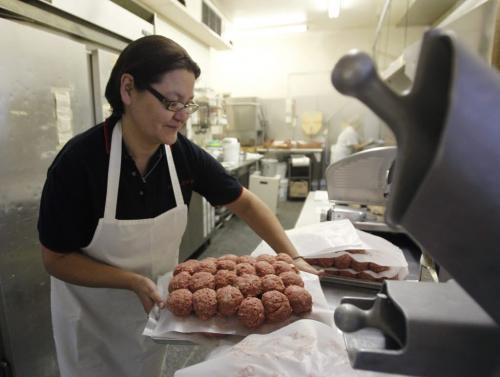 Leona Cook with some of the ground beef she prepared for hamburgers at the C. Kelekis Restaurant on Main St. before the restaurant opened Tuesday morning. The restaurant will be closing Wednesday.  Randy Turner story   (WAYNE GLOWACKI/WINNIPEG FREE PRESS) Winnipeg Free Press  Jan. 29 2013