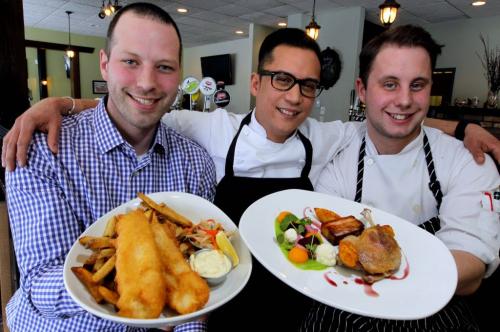Review photo for The Grove Pub and Restaurant. General manager Carew Duffy and chef Norm Pastorin and sou chef Blaire Schreyer pose for a photo with some delicious dishes that are mentioned in the review. Dishes in photo are Fish and Chips and braised duck leg. January 29, 2013  BORIS MINKEVICH / WINNIPEG FREE PRESS