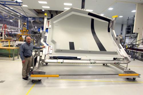 President/General Manager Boeing Winnipeg Kevin Bartelson inside the plant. In this photo he stands next to one of the bigger pieces they make, a landing gear door hatch. NO REPRINT SALES OR DISTRIBUTION. January 29, 2013  BORIS MINKEVICH / WINNIPEG FREE PRESS